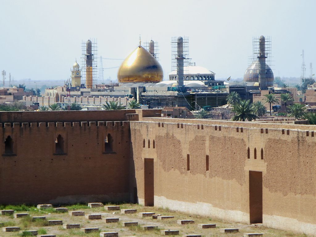 The rebuilt golden dome of the Al-Askari Shrine rising over Samarra