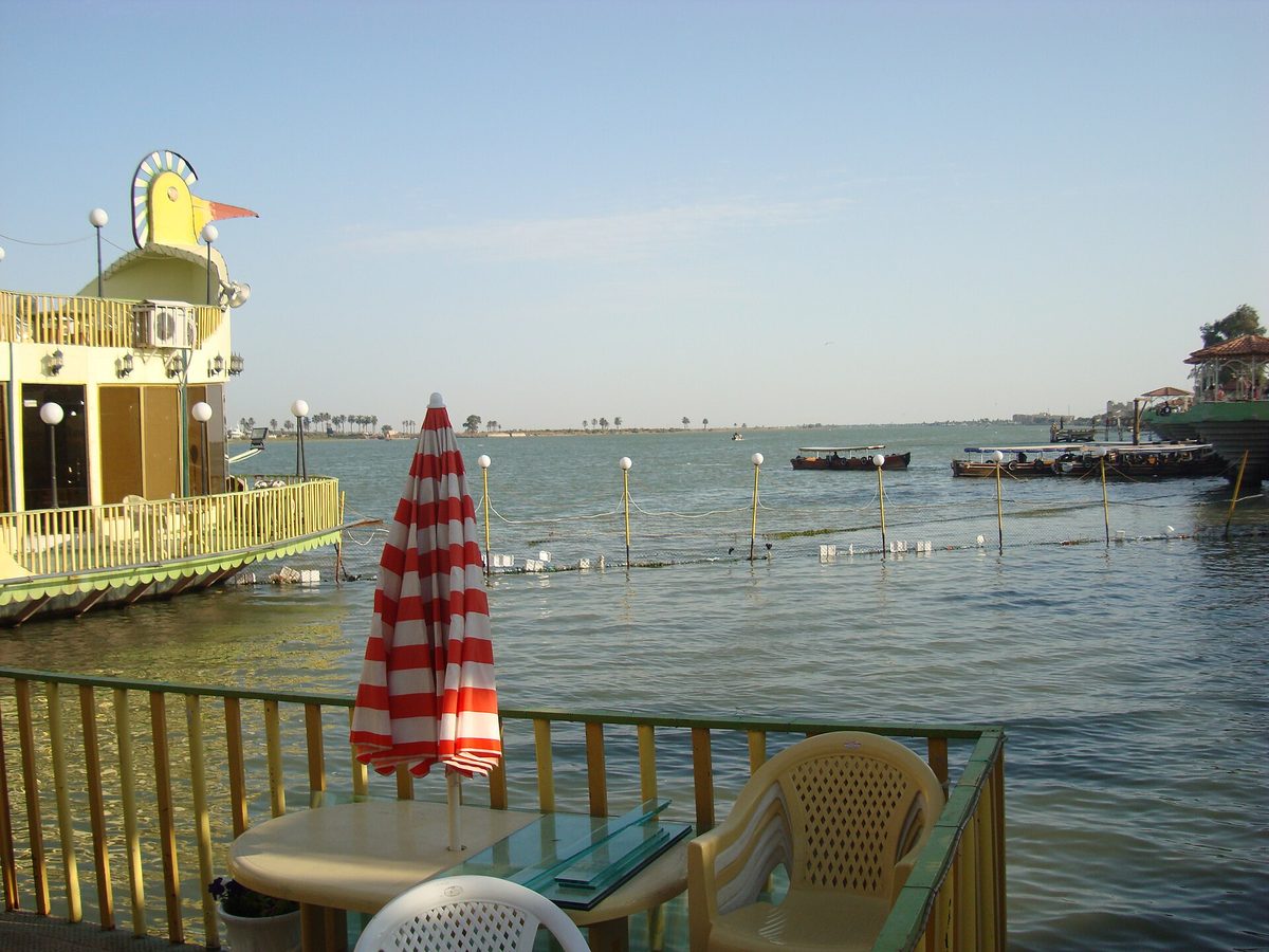 Boats and a riverside cafe on the Shatt al-Arab along Basra's corniche in southern Iraq