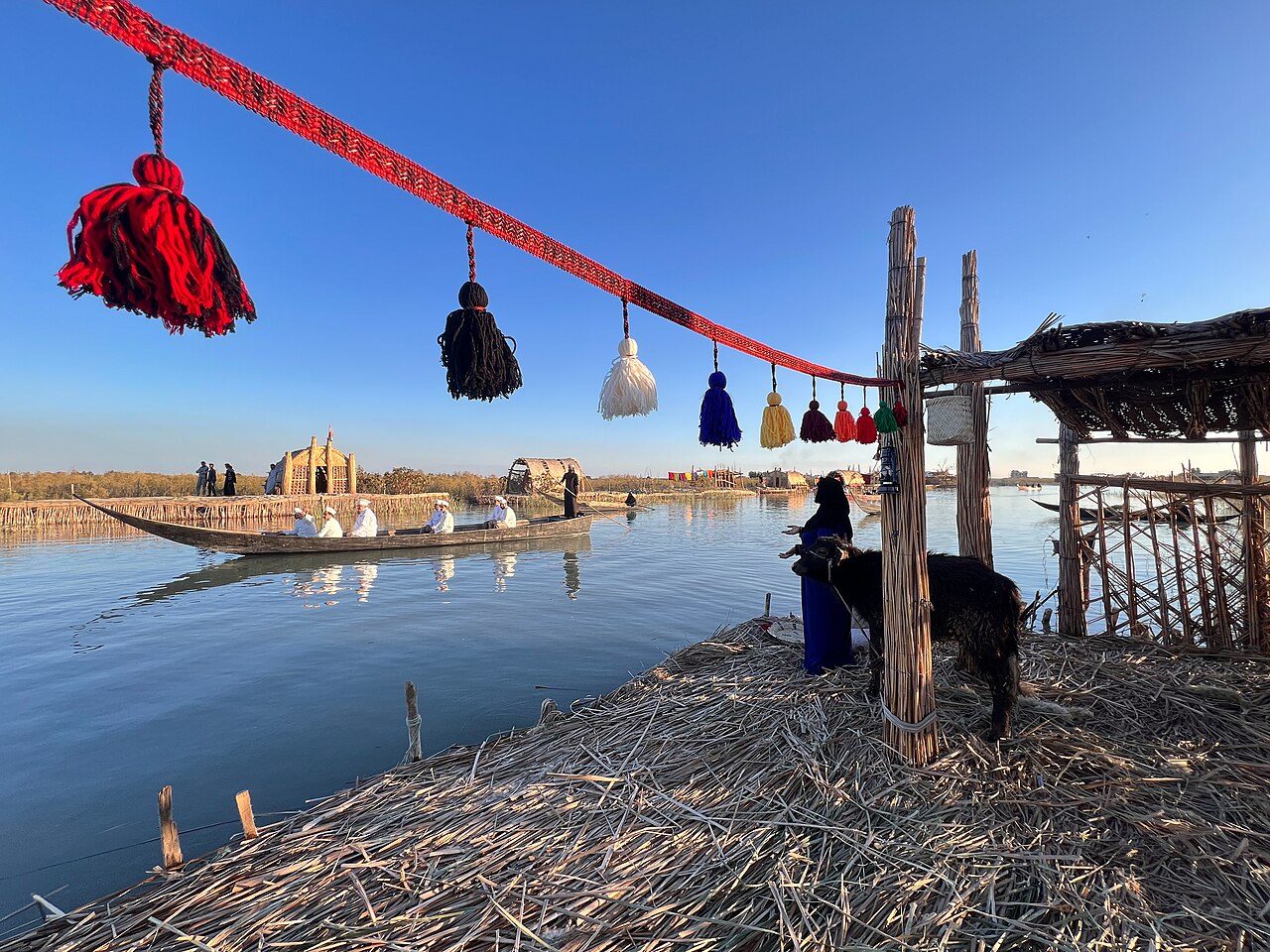 A mashuf canoe and reed mudhif in the Mesopotamian Marshes near Nasiriyah, southern Iraq