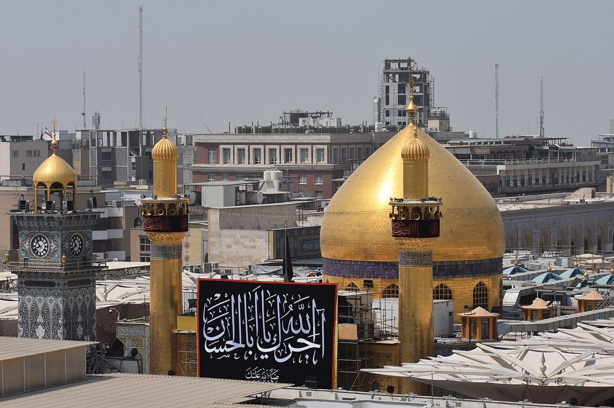 Golden domes of a Shia holy shrine in Iraq, where religion shapes daily life