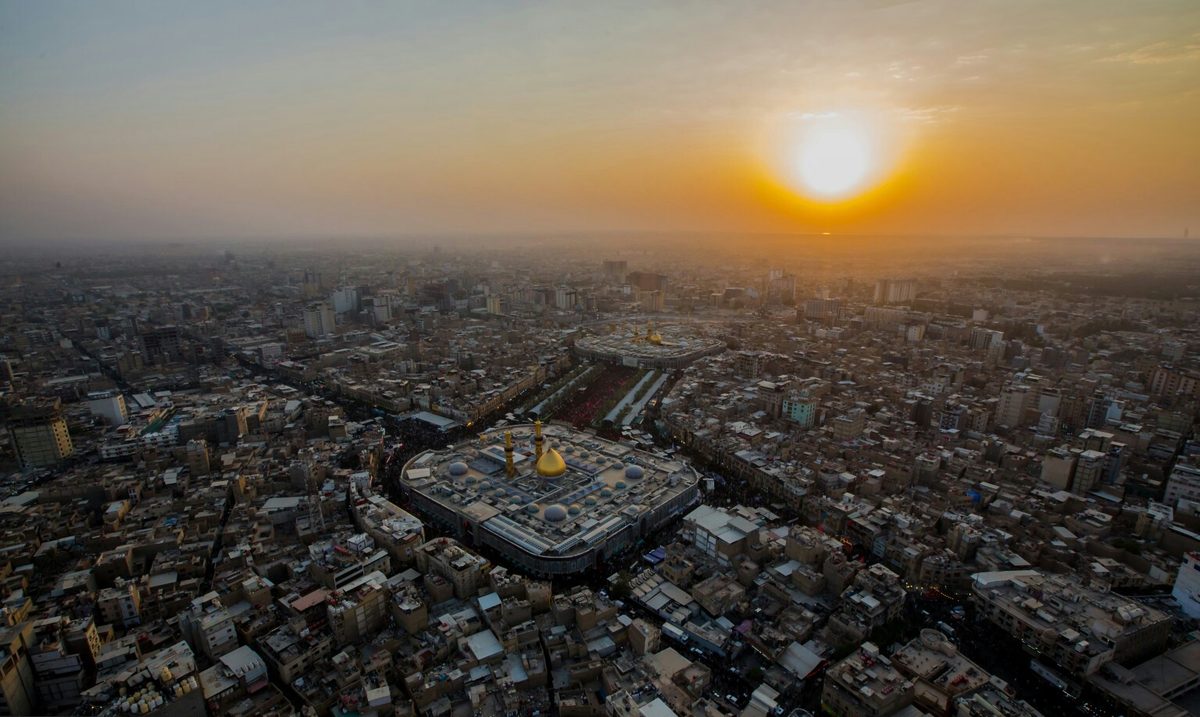 Aerial view of the Imam Husayn and Al-Abbas shrines in Karbala at sunset
