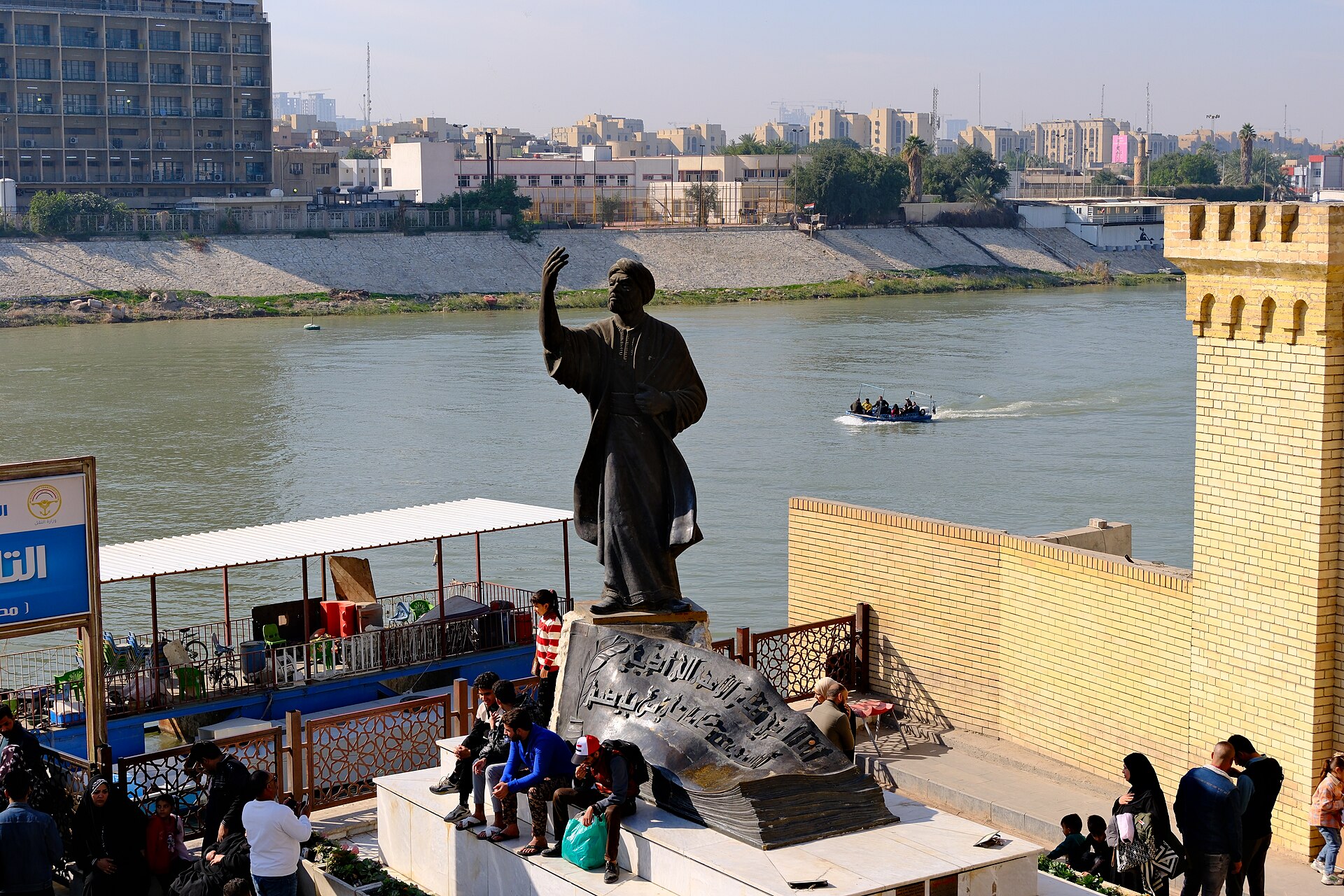The bronze statue of the poet al-Mutanabbi standing above the Tigris at the end of Mutanabbi Street