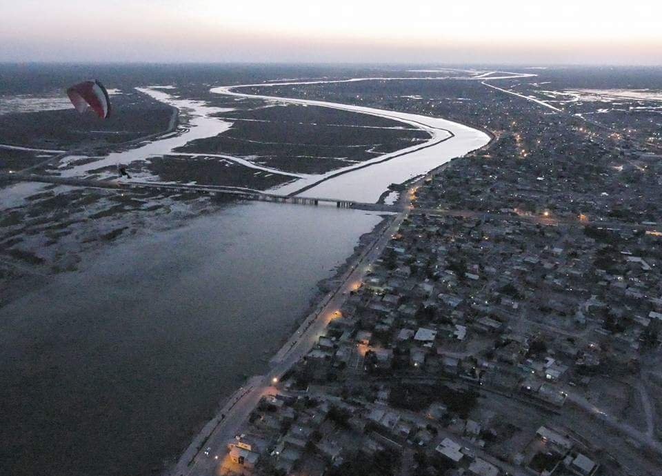 Aerial view at dusk over the town of Chibayish in Dhi Qar province and the surrounding marsh channels