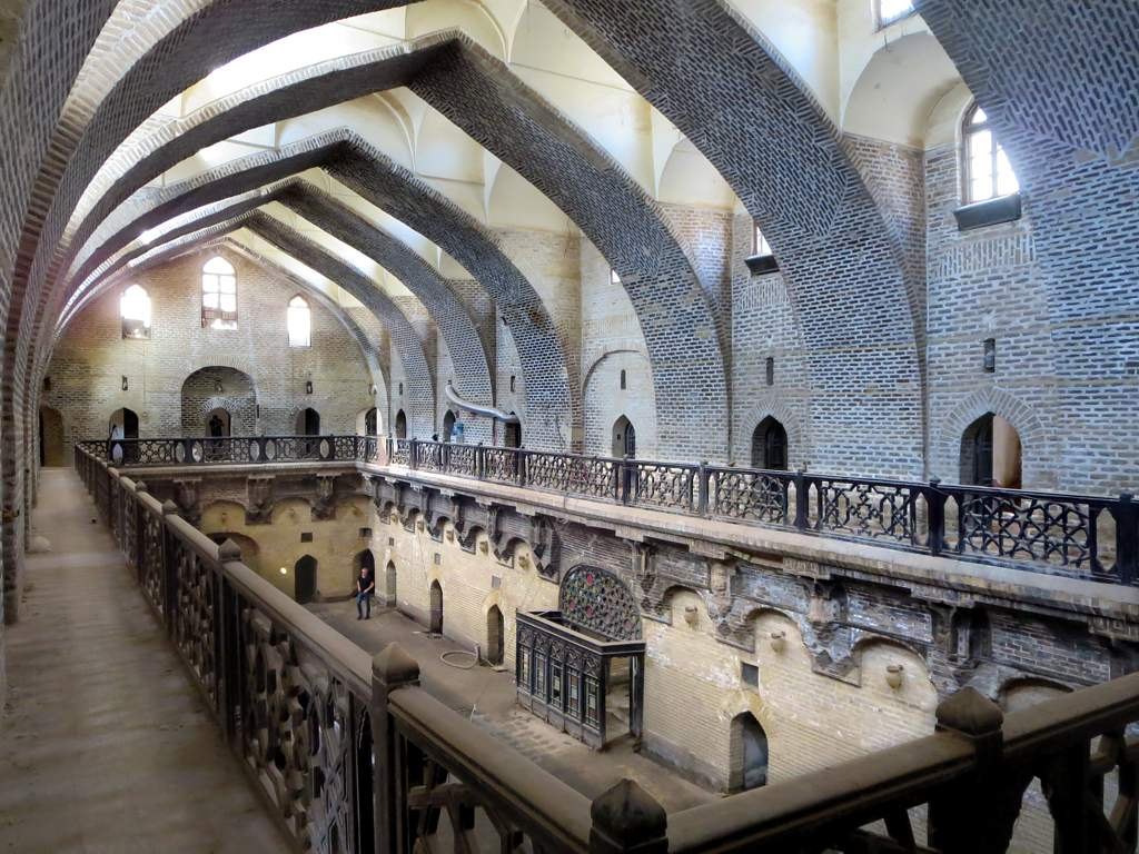 The vaulted brick hall of Khan Murjan, a 14th-century caravanserai in old Baghdad
