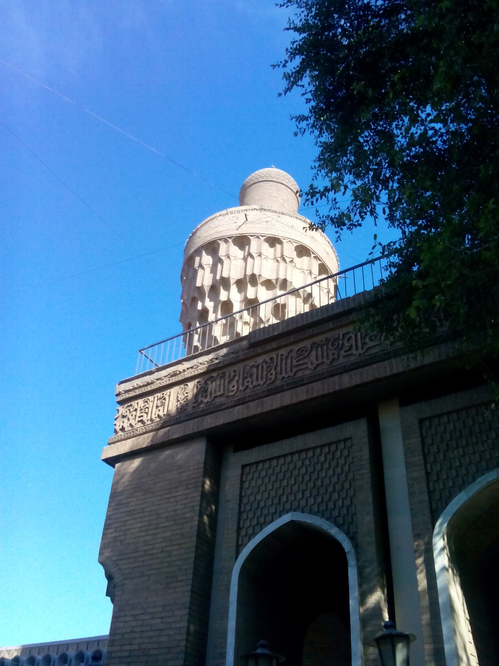 The brick minaret of al-Khulafa Mosque in Baghdad, known as the Suq al-Ghazl minaret, seen from below