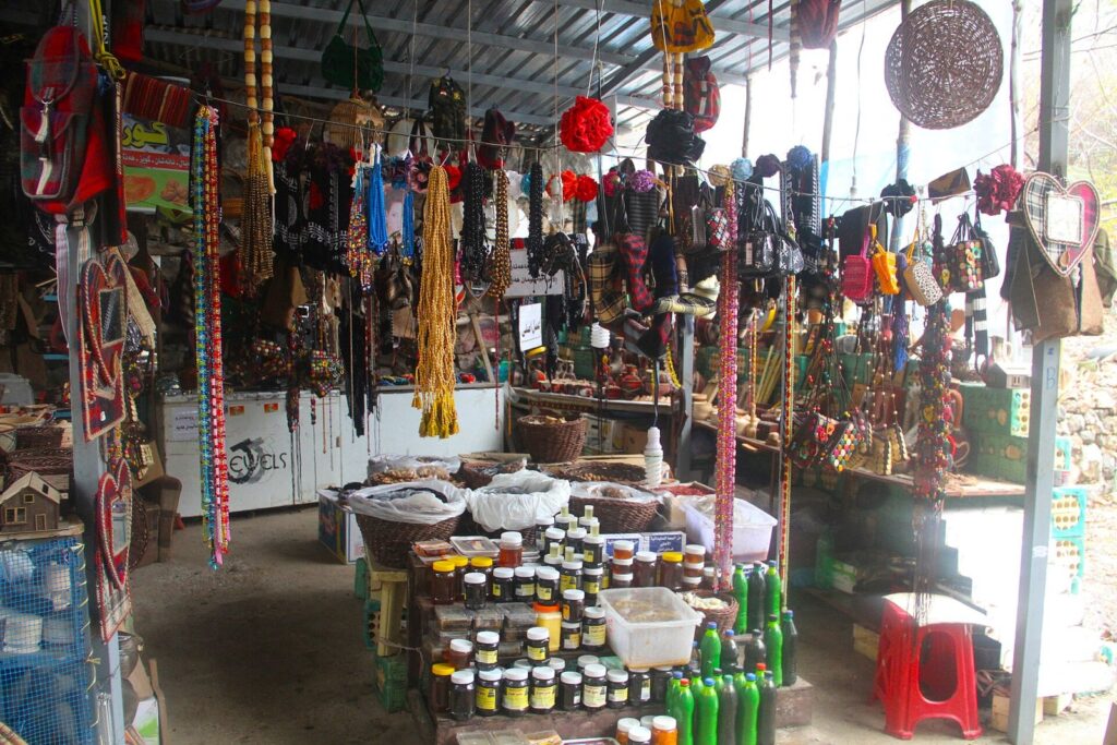 Stalls selling Kurdish crafts, prayer beads and honey at Ahmed Awa