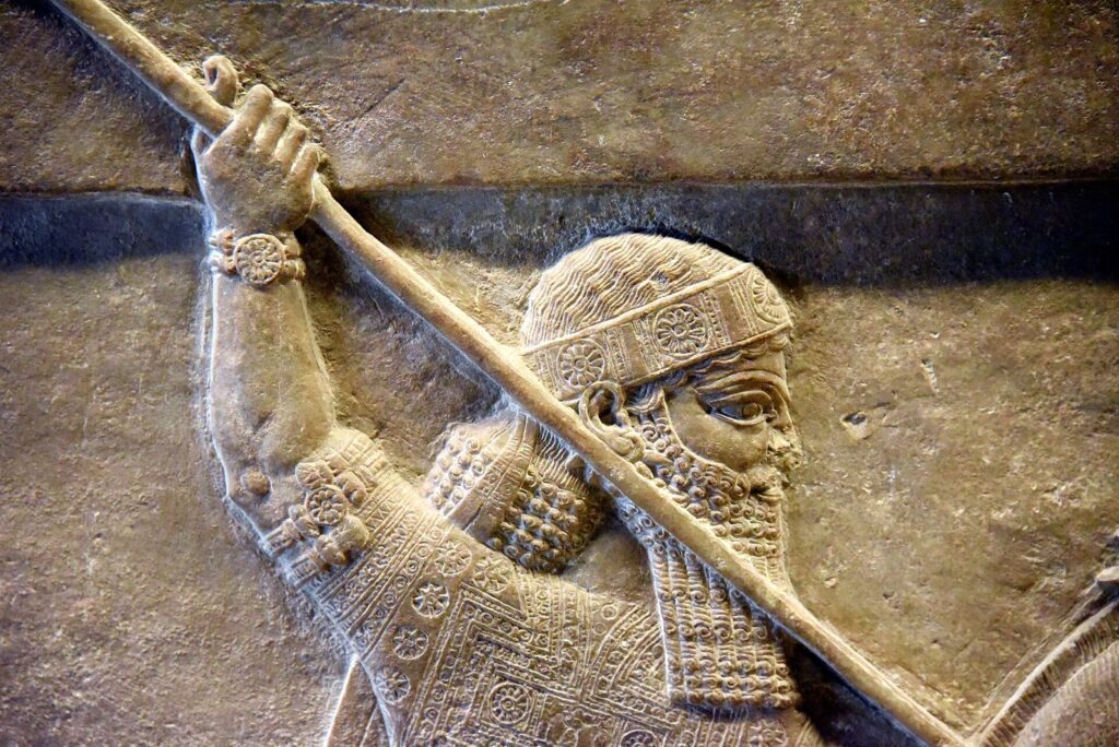 Assyrian relief of King Ashurbanipal thrusting a spear during a lion hunt, from the North Palace at Nineveh