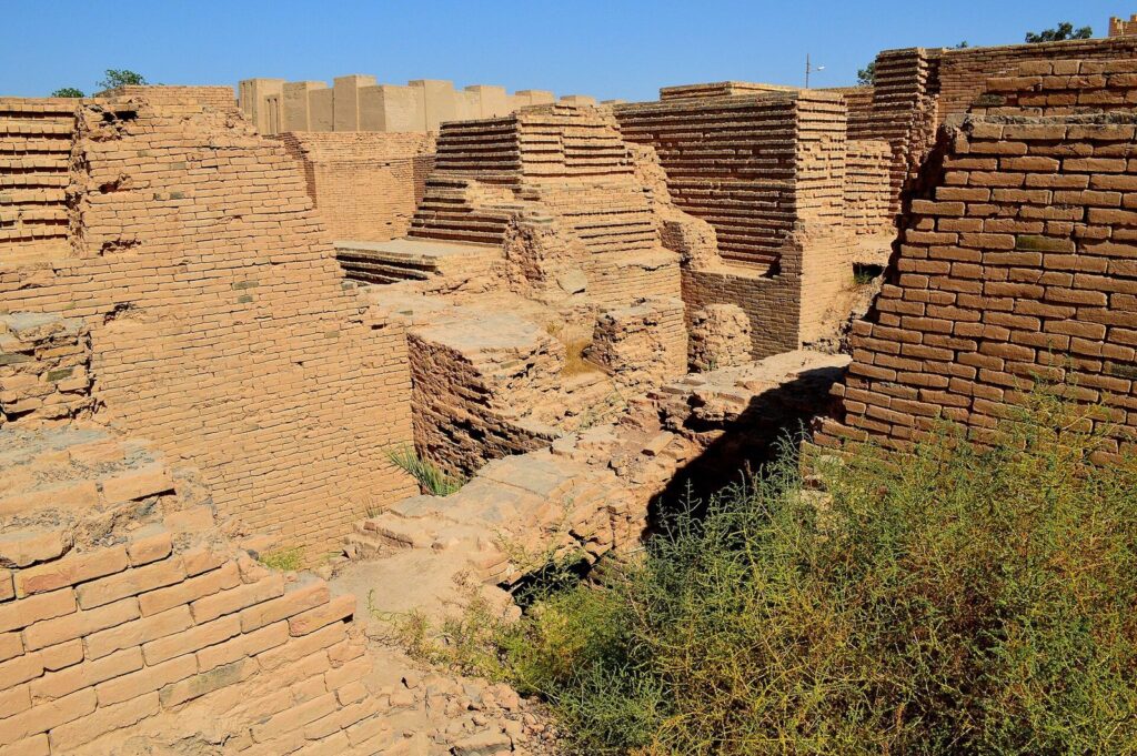 Original weathered mud-brick walls among the ruins of ancient Babylon