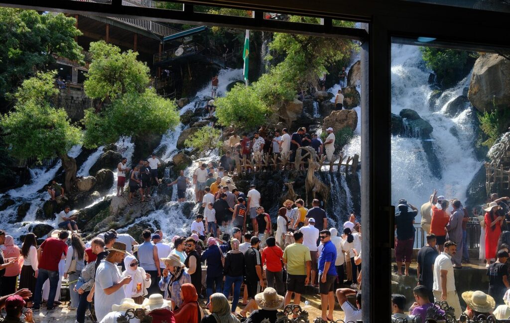 Crowds of summer visitors on the viewing terraces around Bekhal waterfall near Rawanduz