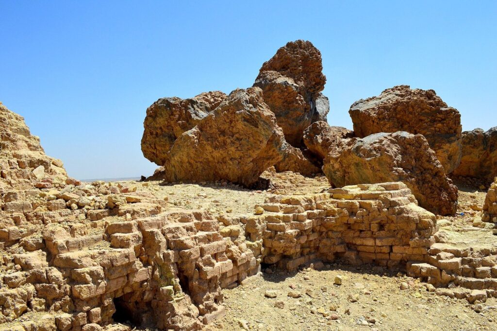 Heat-fused brick blocks on the upper surface of the ziggurat of Nabu at Borsippa under a blue sky