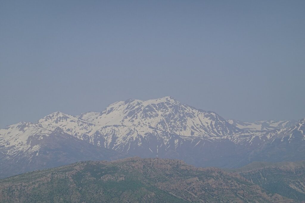 The snow-covered massif of Halgurd, the Kurdistan Region's second-highest mountain, rising above lower ridges