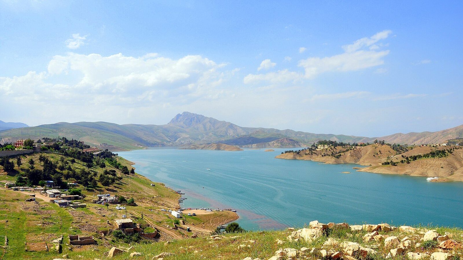 Lake Dukan between green hills, the eastern end of a week-long Kurdistan itinerary
