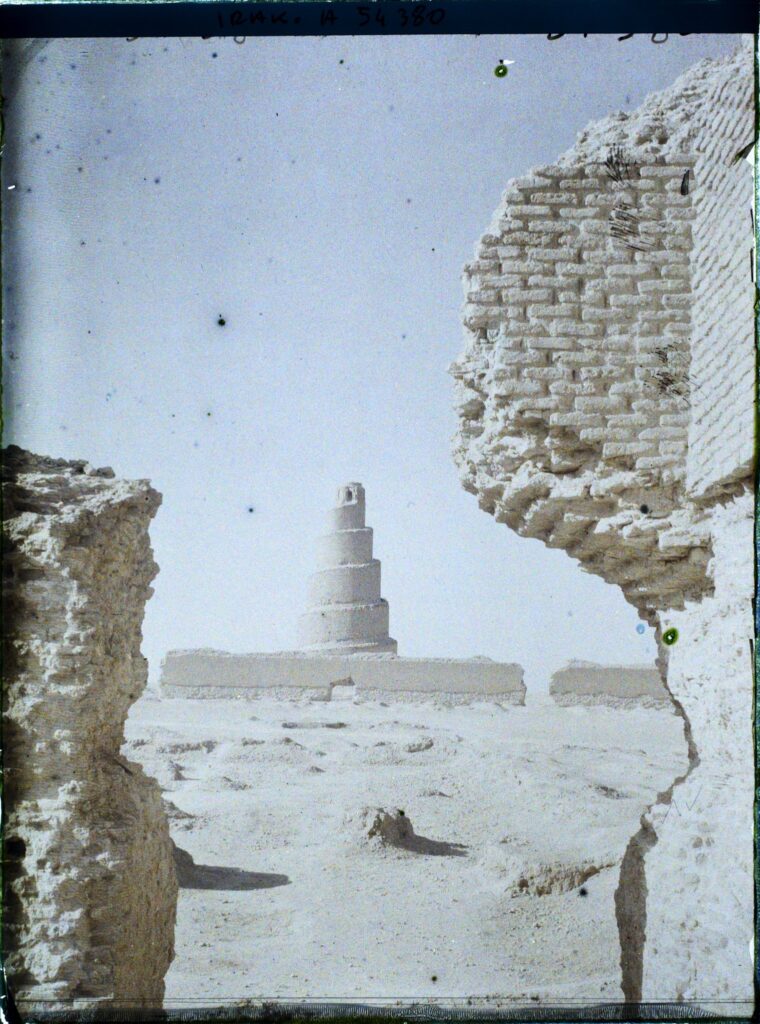 Early colour autochrome of the Malwiya minaret at Samarra framed by a broken mud-brick wall in 1927