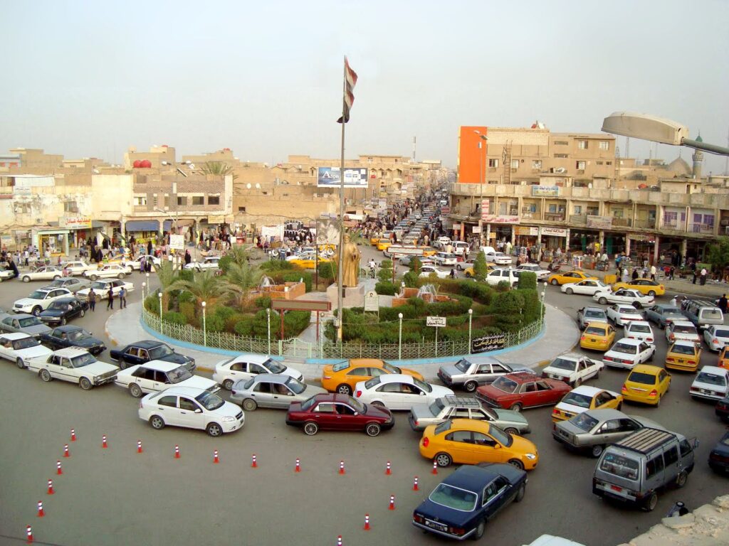 Traffic around a central square in Nasiriyah, the base for visiting Ur