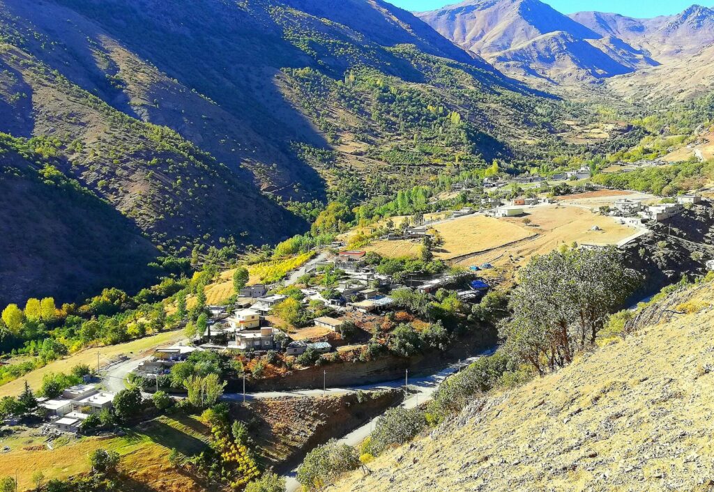The village of Nawanda in the Balakayati valley near Choman with autumn trees and bare mountains above