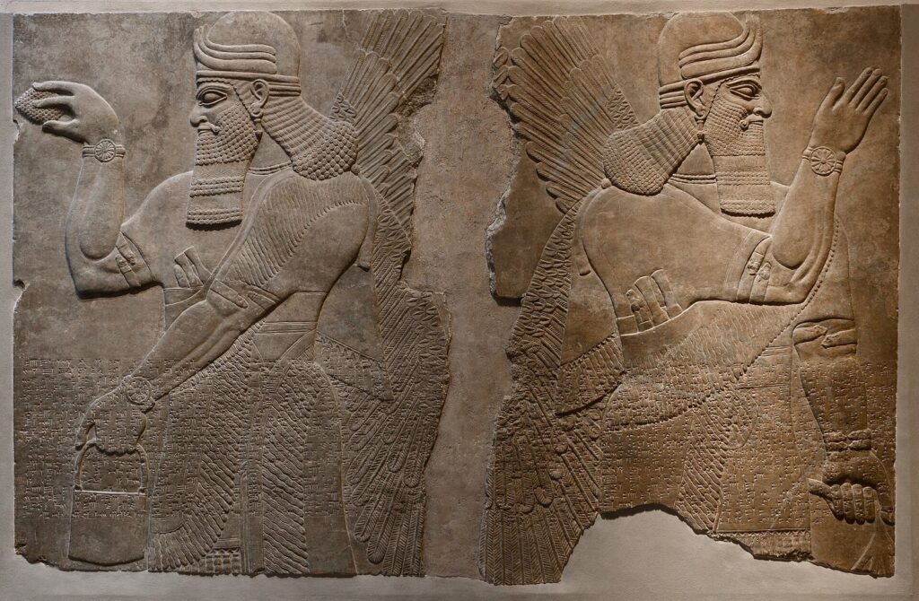 Two winged protective spirits carved in relief from Ashurnasirpal II's palace at Nimrud, displayed in a museum