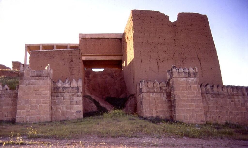 The partly reconstructed Adad Gate of Nineveh, a mud-brick and concrete gatehouse set in the ancient city wall