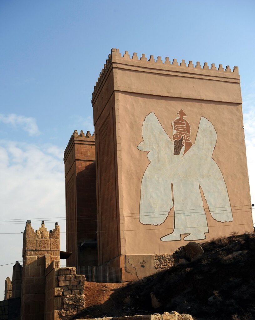 Tower of the Nergal Gate at Nineveh with a painted outline of a winged bull-man on its brick face