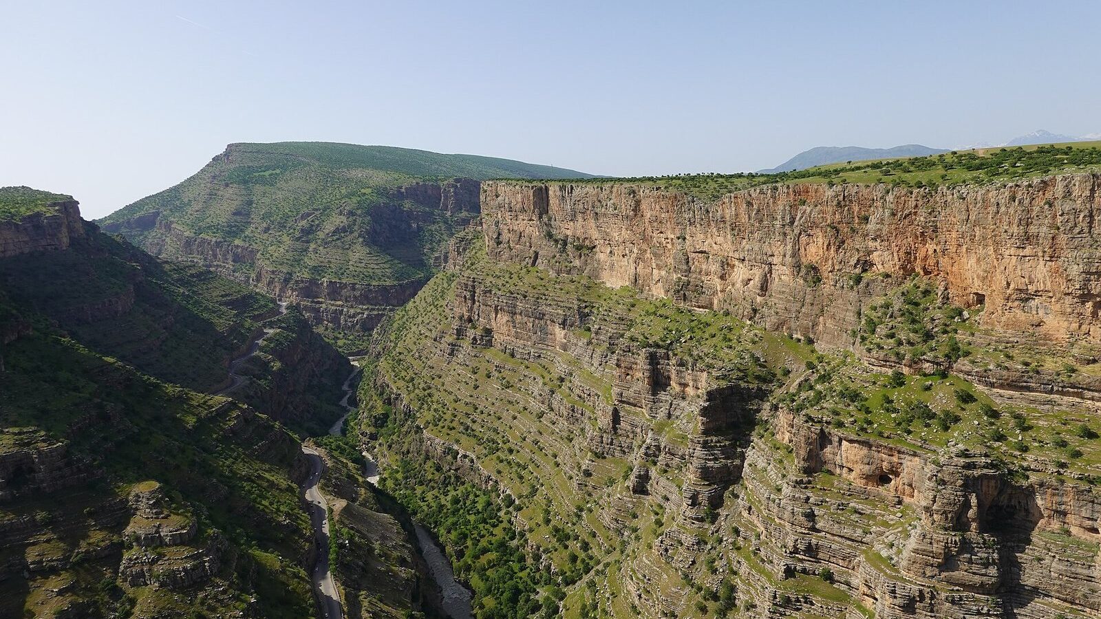 The Rawanduz canyon near Kharand, with layered rock walls and green slopes