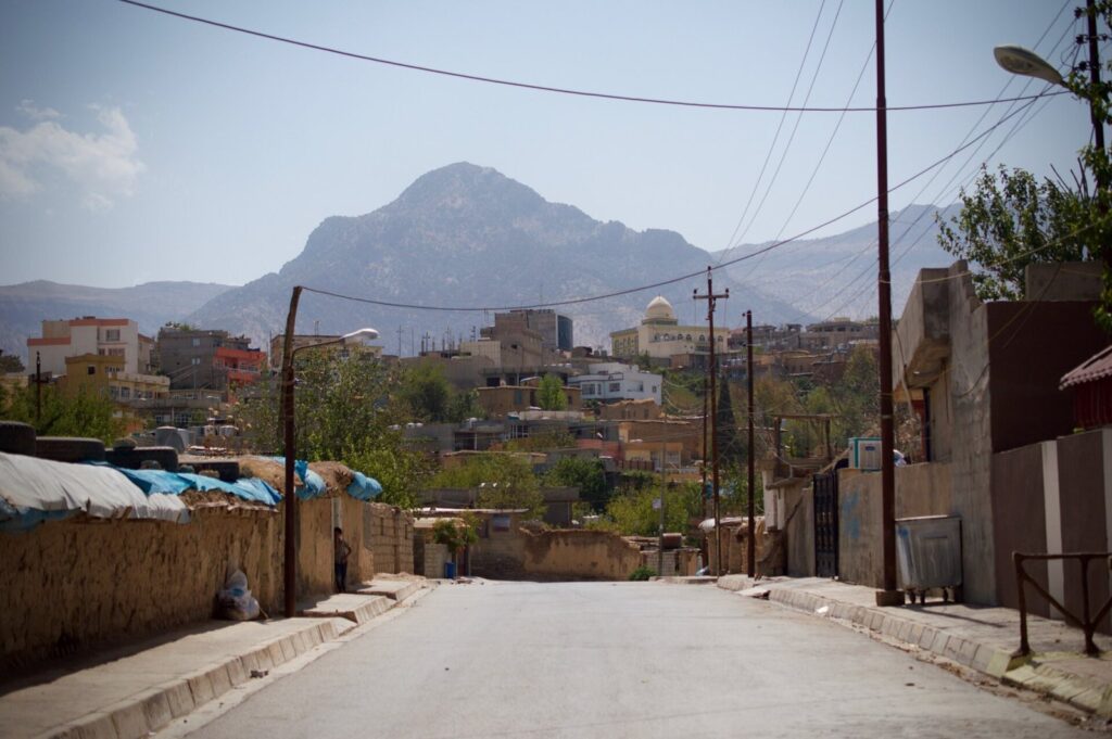 A street in Rawanduz town with mountains beyond