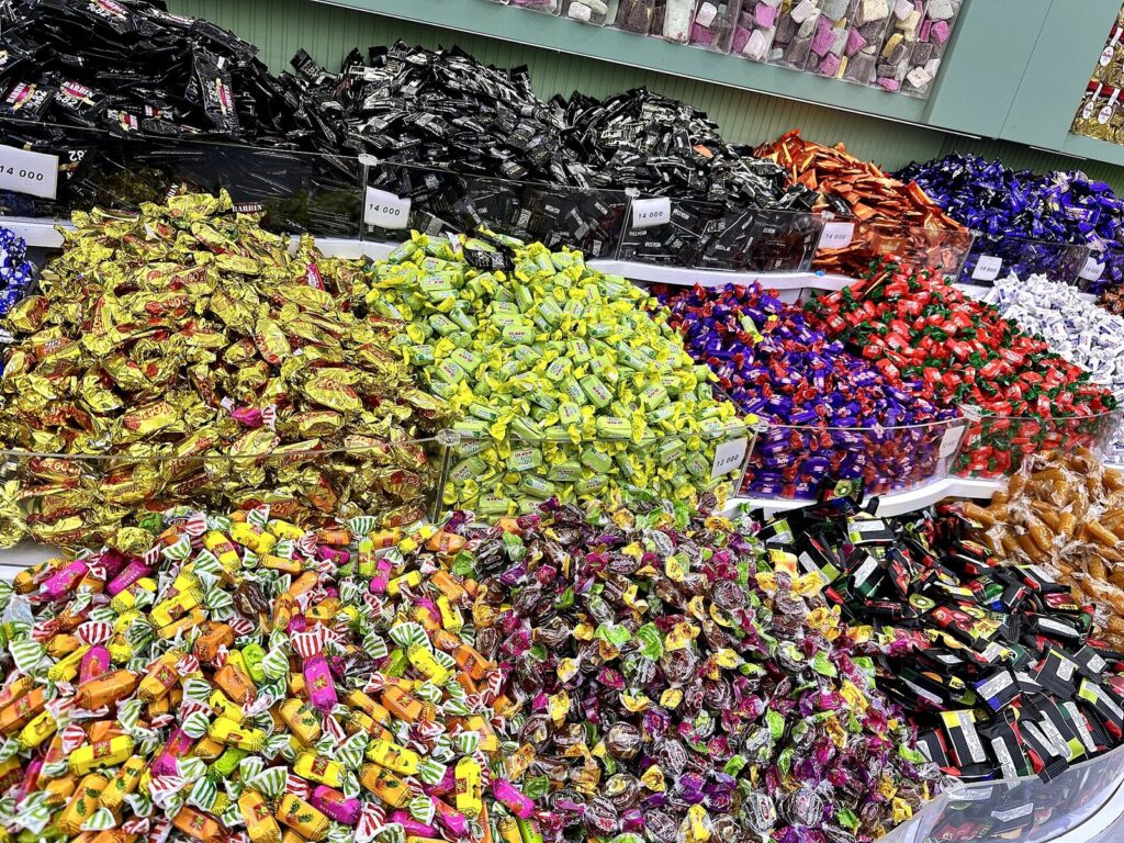 Colourful wrapped sweets piled high in a shop in Shaqlawa bazaar