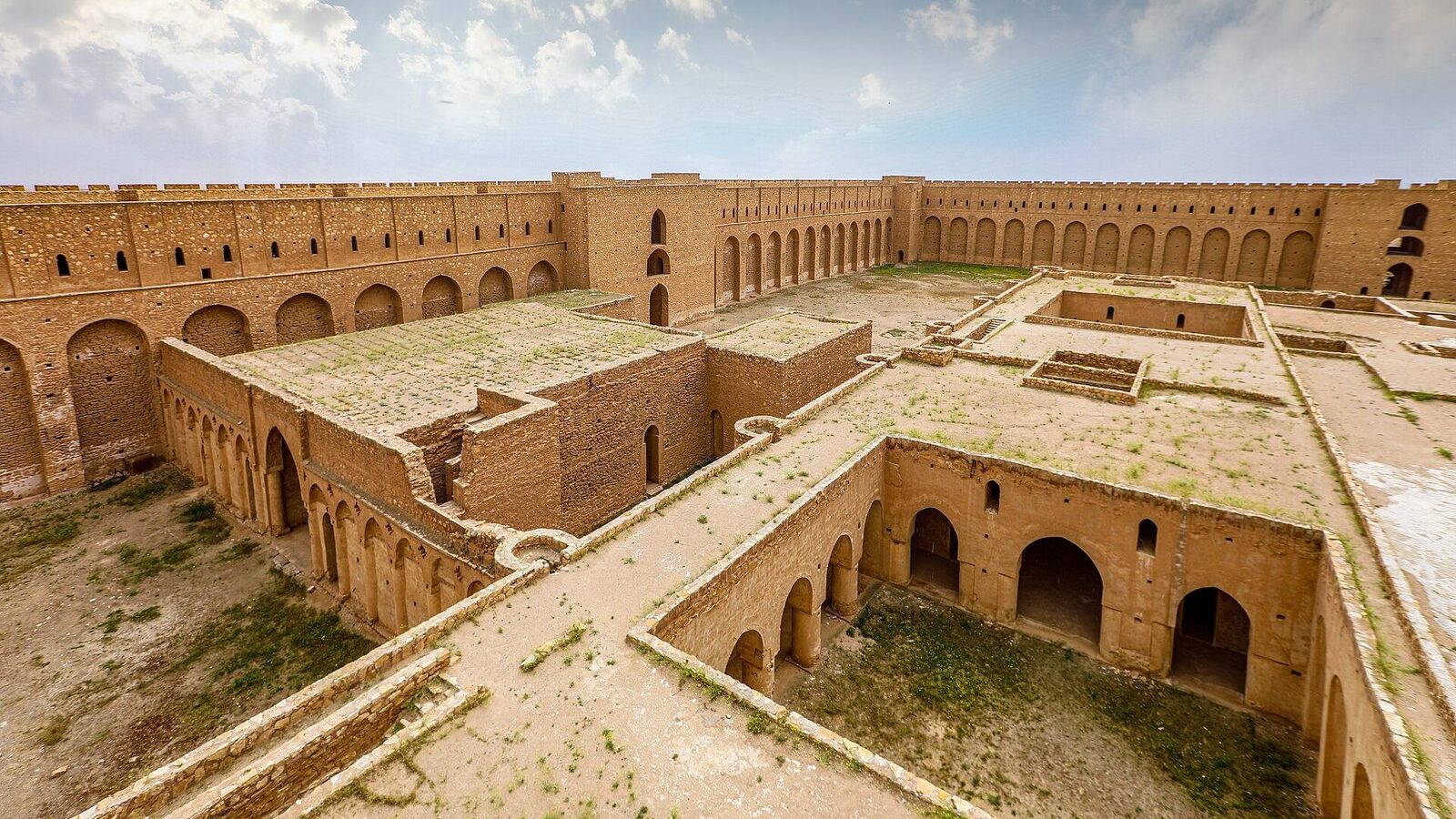 The courtyards, vaulted halls and towered outer wall of the Ukhaidir fortress in the desert south of Karbala
