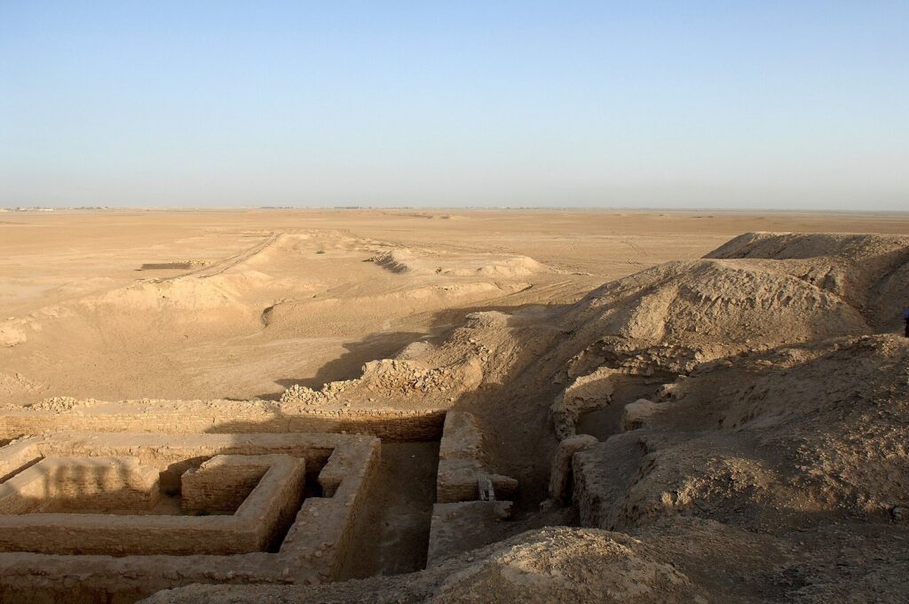 The eroded mounds and excavated mud-brick walls of ancient Uruk at Warka, a highlight of this Iraq itinerary for 10 days