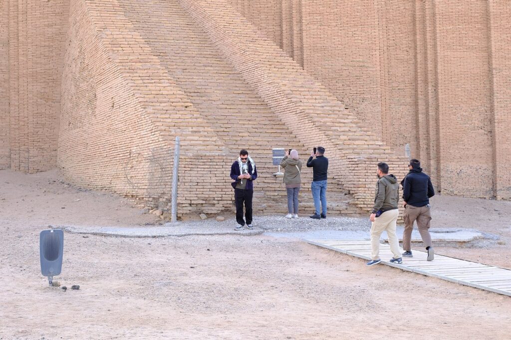 Visitors at the fenced foot of the Ziggurat of Ur's great staircase near Nasiriyah, a stop on this Iraq itinerary for 7 days